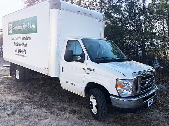 a white truck from Commercial Pine Straw